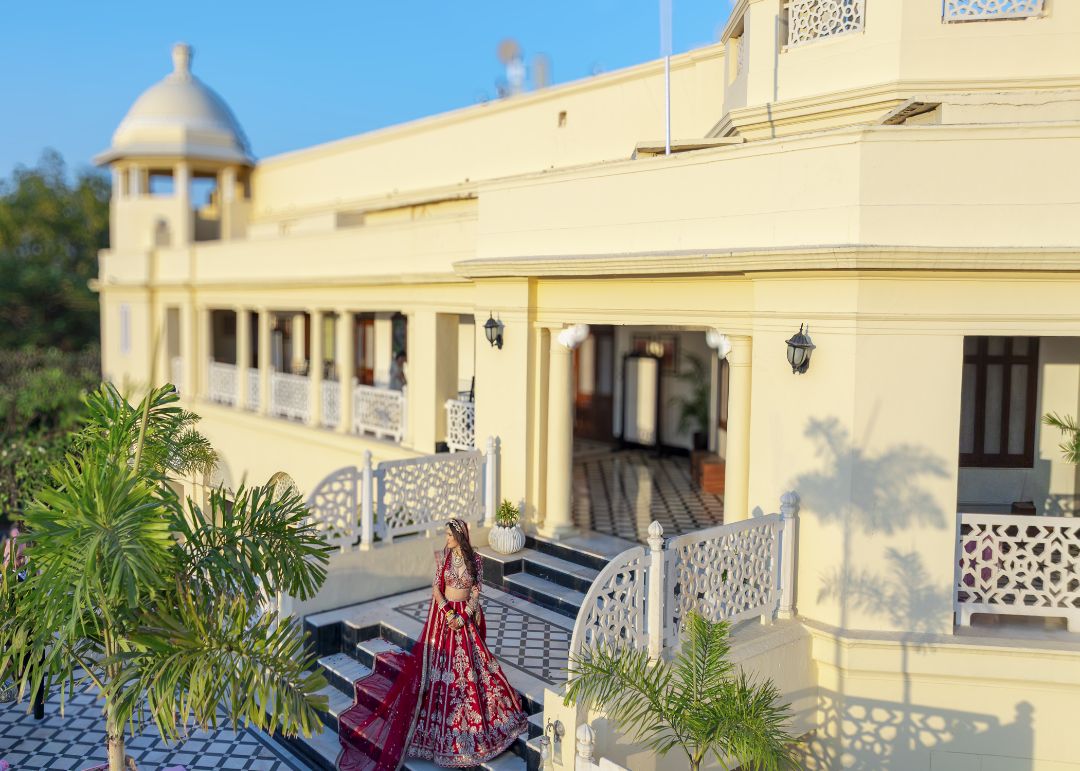 "The majestic palace stood tall, yet her bridal presence commanded the entire scene."